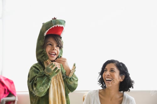 Preview: Boy In Dragon Costume Laughing With Mother