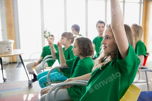 Preview: Elementary Students With Recycle Signs In Classroom