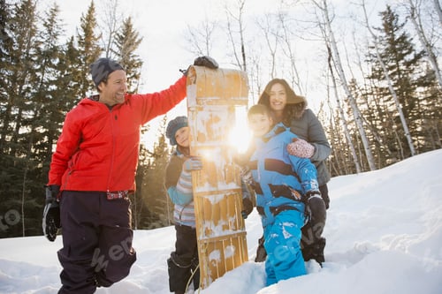 Preview: Portrait Of Smiling Family And Toboggan Outdoors