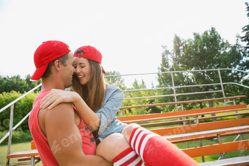 Preview: Man Holding Girlfriend In Bleachers