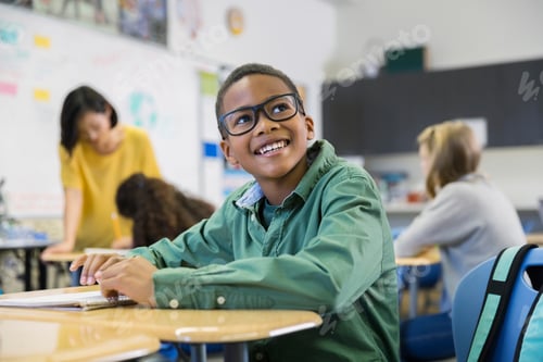 Preview: Smiling Elementary Student In Classroom