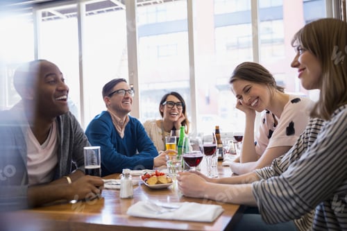 Preview: Friends Drinking Beer And Wine At Bistro Table