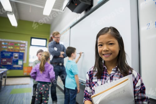 Preview: Portrait Of Smiling Elementary Student In Classroom