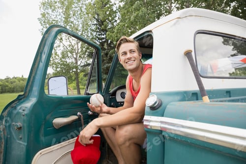 Preview: Man Sitting In Truck In Field