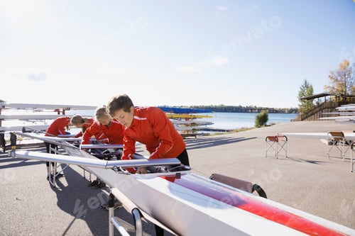 Preview: Rowing Team Preparing Scull At Waterfront