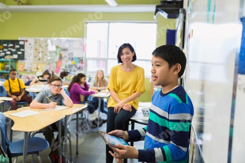 Preview: Student With Digital Tablet In Front Of Classmates