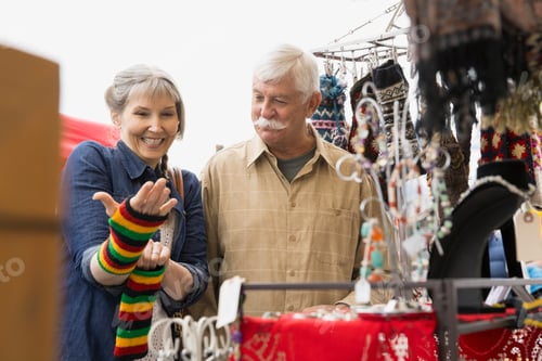 Preview: Older Couple Shopping At Outdoor Market