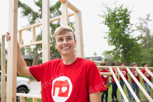 Preview: Smiling Volunteer At Construction Frame