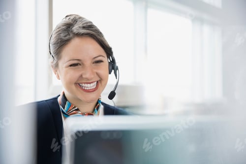 Preview: Airport Customer Service Representative With Headset At Computer