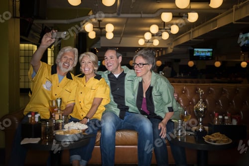 Preview: Friends In Bowling Shirts Taking Selfie Bowling Alley