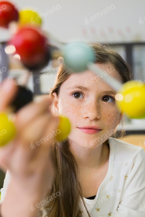 Preview: Elementary Student Examining Molecule Model