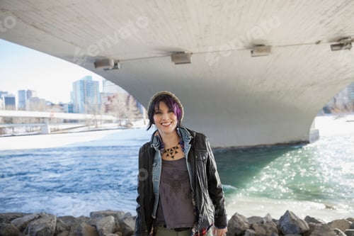 Preview: Portrait Of Smiling Woman Standing Under Bridge