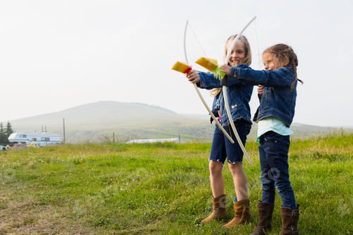 Preview: Girls Playing With Bows And Arrows In Field