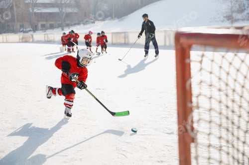 Preview: Hockey Player Practicing On Ice Rink