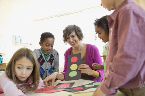 Preview: Teacher Reviewing Road Signals With Elementary Students