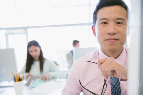 Preview: Portrait Of Confident Businessman In Office