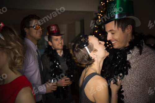 Preview: Affectionate Couple Enjoying New Years Eve Party
