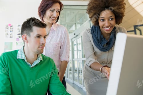 Preview: Business People Working At Computer In Office