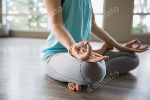 Preview: Woman In Lotus Position Practicing Mudra Meditation