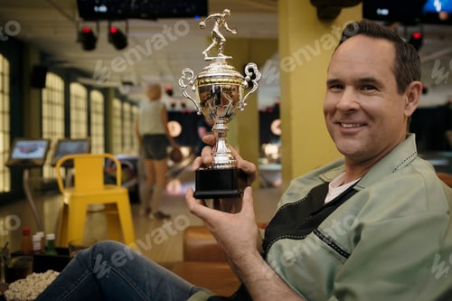 Preview: Portrait Confident Man Holding Bowling Trophy