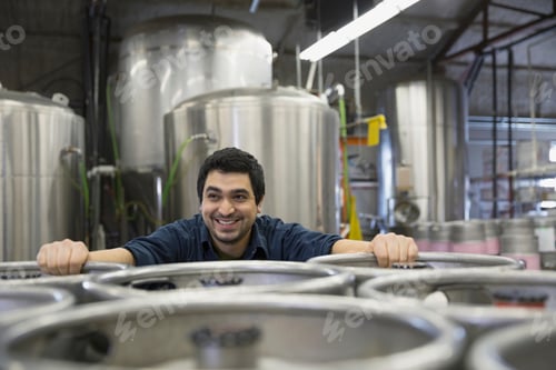 Preview: Brewery Worker Leaning On Kegs