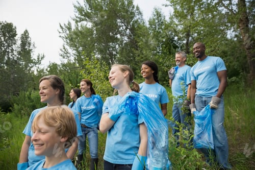 Preview: Volunteers Carrying Garbage Bags In Field