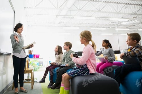 Preview: Elementary Students Listening To Teacher In Classroom
