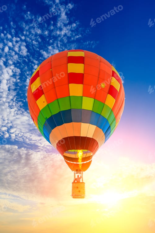 Preview: Hot Air Balloon Floating In The Sky At Sunset.