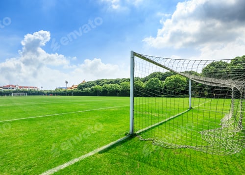 Preview: Green Football Field Under Blue Sky Background