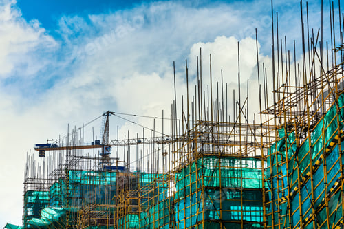 Preview: Crane And Building Construction Site Against Blue Sky.