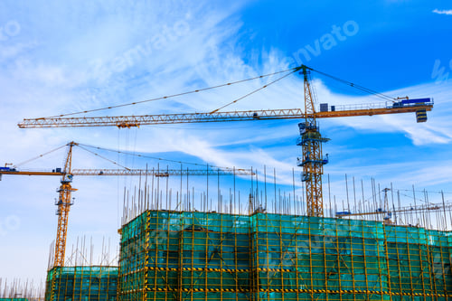 Preview: Crane And Building Construction Site Against Blue Sky.