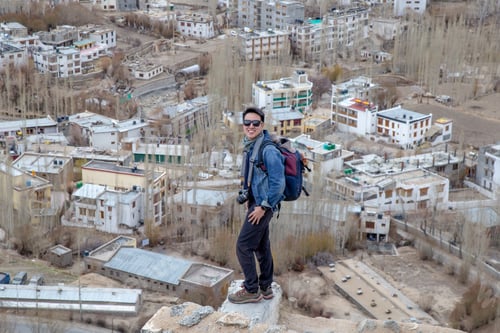 Preview: Traveler Man Standing On Leh Ladakh City View From Shanti Stupa. Beautiful Amazing Village In The