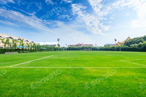 Preview: Green Football Field Under Blue Sky Background