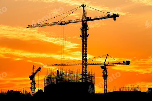Preview: Crane And Building Construction Site At Sunset