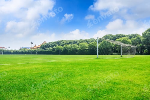 Preview: Green Football Field Under Blue Sky Background