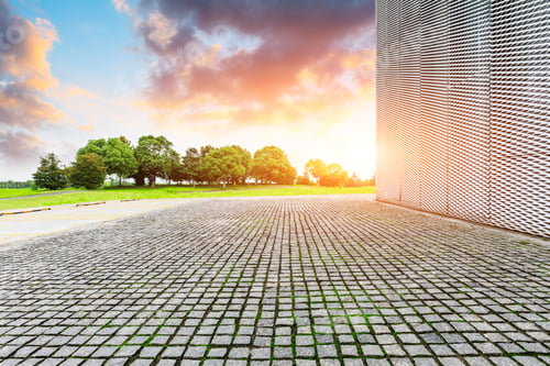 Preview: Empty Square Stone Floor And Wall With Green Tree At Sunset.