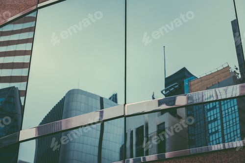 Vista previa: Reflections Of Modern Commercial Buildings On Glasses