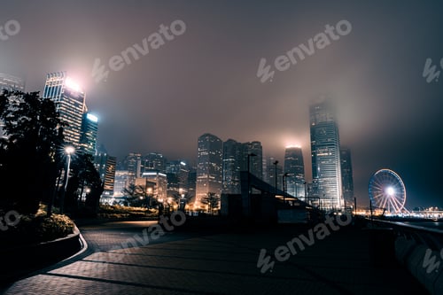 Preview: Modern Office Buildings In Hong Kong At Foggy Night