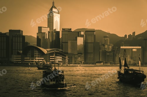 Preview: Silhouette Of Hong Kong Victoria Harbour With Junk Boat On Foreground. During Sunset; Vintage Style