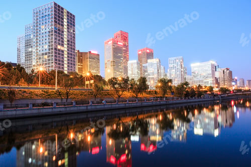 Preview: Business District Office Buildings And Water Reflection In Beijing At Night