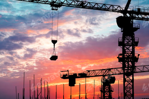 Preview: Crane And Building Construction Site At Sunset