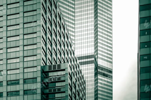Preview: Bottom Up View Of Modern Office Building In Green Color