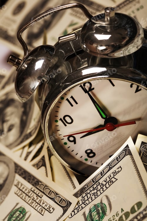 Preview: Close Up Of The Oldfashioned Alarm Clock With Money