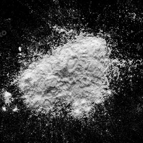 Pile of White Powder on a Black Surface