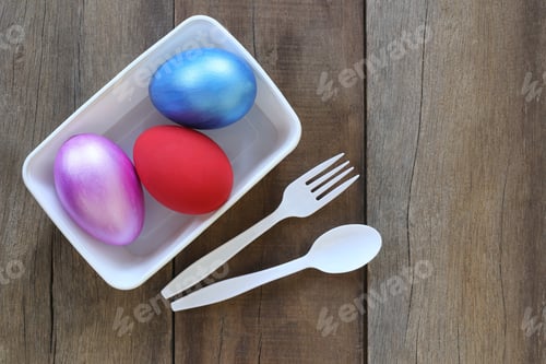 Preview: Easter Egg A Variety Of Colors In Plastic Bowl And Have Spoon,Fork On Old Wood Background.