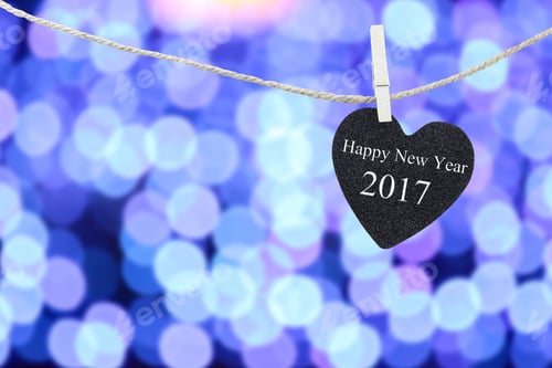 Preview: Black Heart Hung On Hemp Rope And Blue Abstract Bokeh Background,Concept Of The New Year 2017.