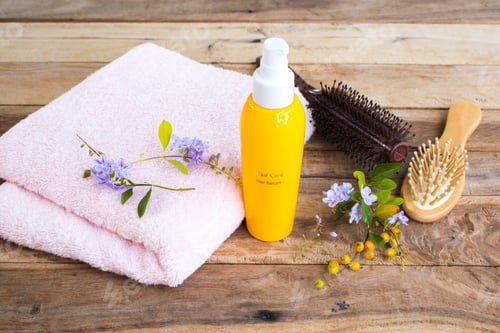 Preview: Hair Care Product with Brushes and Flowers