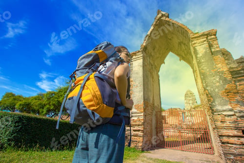 Preview: A Young Woman Walks By A Backpacker In Ayutthaya Province, Thailand.