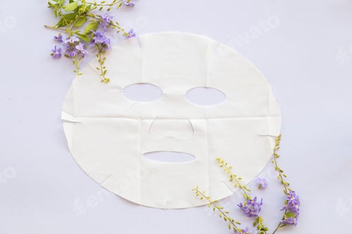 Preview: Natural Sheet Mask For Health Care Skin Face From Herbal Flowers On Background White