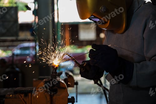 Preview: Welders Are Working To Weld Metal That Has Light From Welding, Splashing Out Into The Workplace
